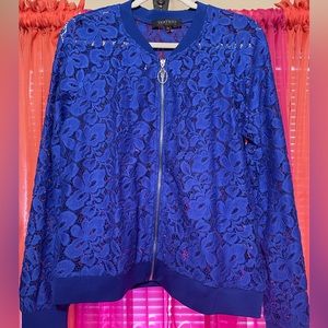 Long sleeve, royal blue, sliver zip up jacket.